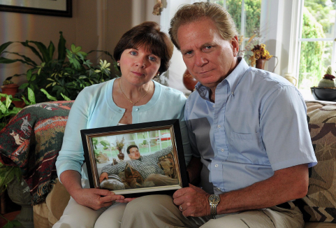 The Smolinski family holding a picture of Billy. Photo courtesy of the Smolinski family.